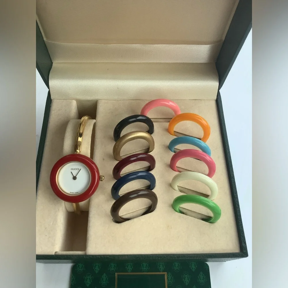 Gucci Women’s Gold Bangle Watch with Interchangeable Color Bezels